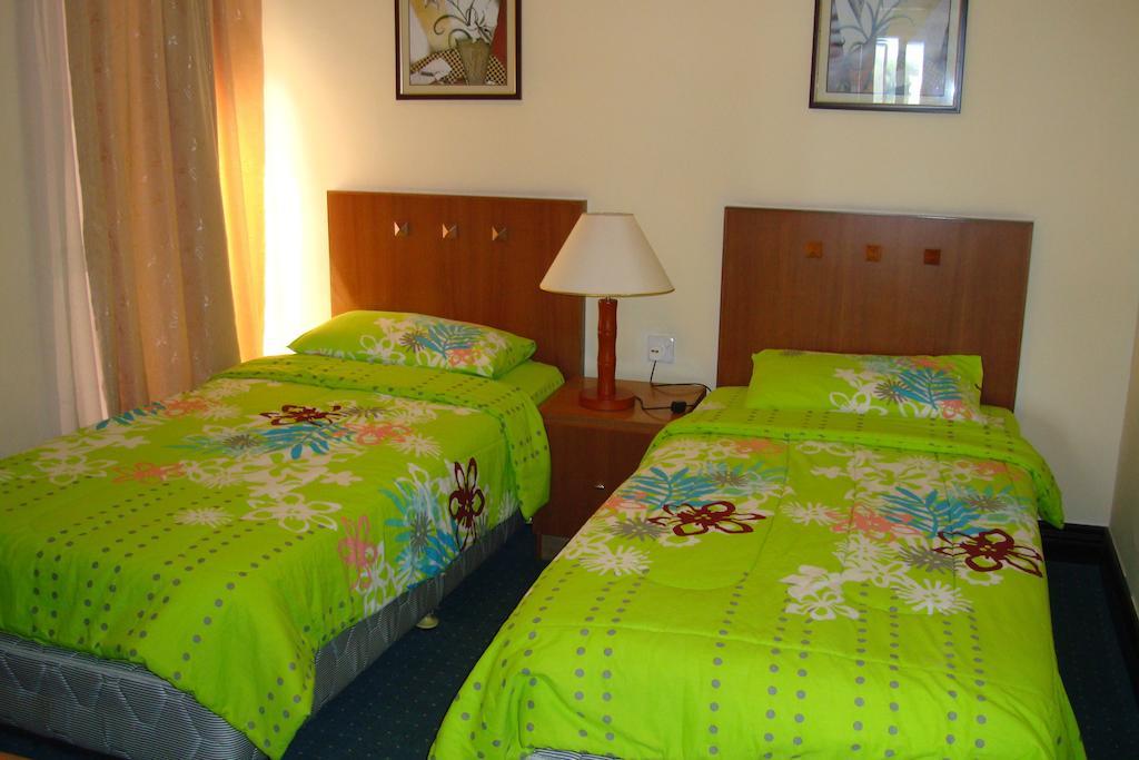 Dorcas Service Apartment - Marina Court Кота-Кинабалу Номер фото